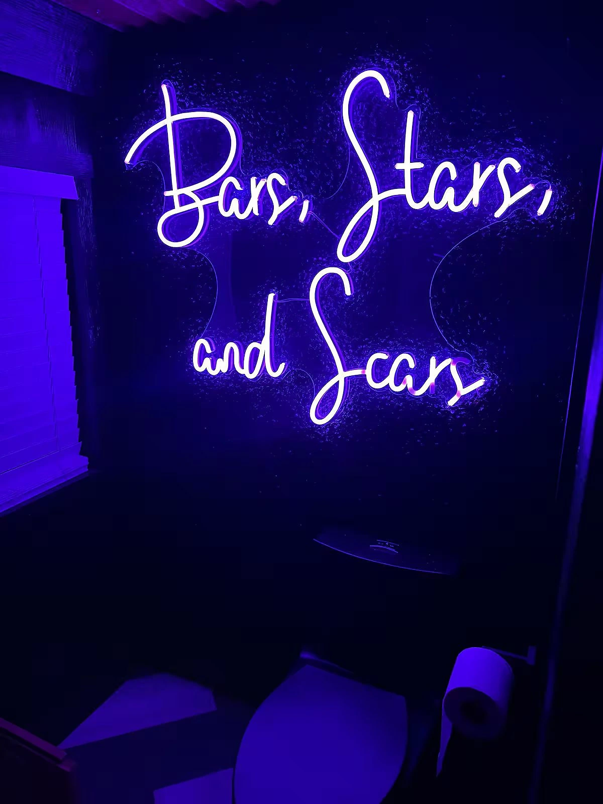 Interior of the neon-lit bar cabin at Moto Supreme in Norman, Indiana