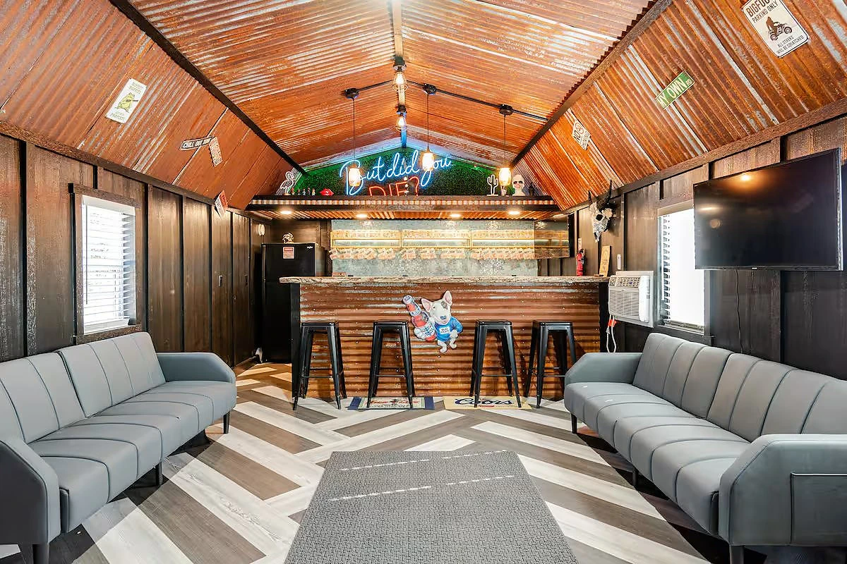 Corrugated ceiling and lounge seating in the bar cabin