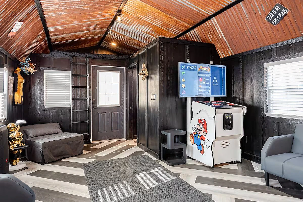 Arcade machine and gathering space in the Moto Supreme bar cabin