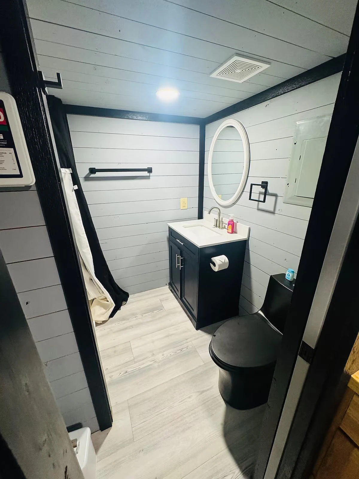 Cabin bathroom with vanity and shower at Moto Supreme