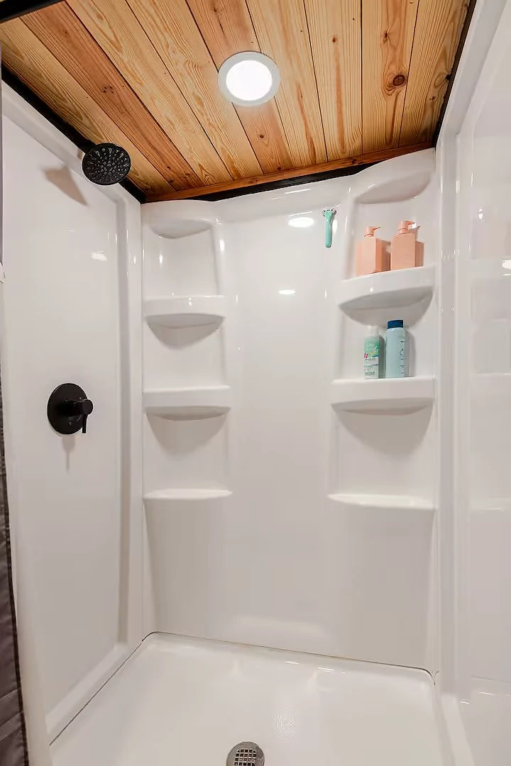 Cabin bathroom with vanity and shower at Moto Supreme