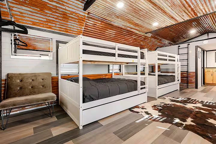Beds and seating inside a cabin at Moto Supreme