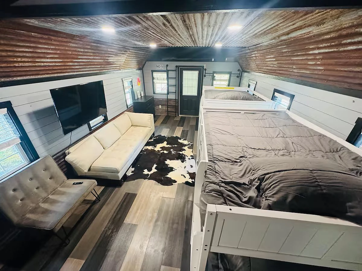 Beds and seating inside a cabin at Moto Supreme