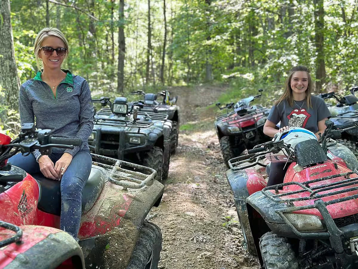 Private off-road trail winding through the woods at Moto Supreme