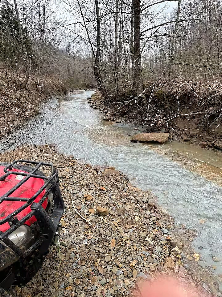 Trail cut through the trees on private land in Norman, Indiana